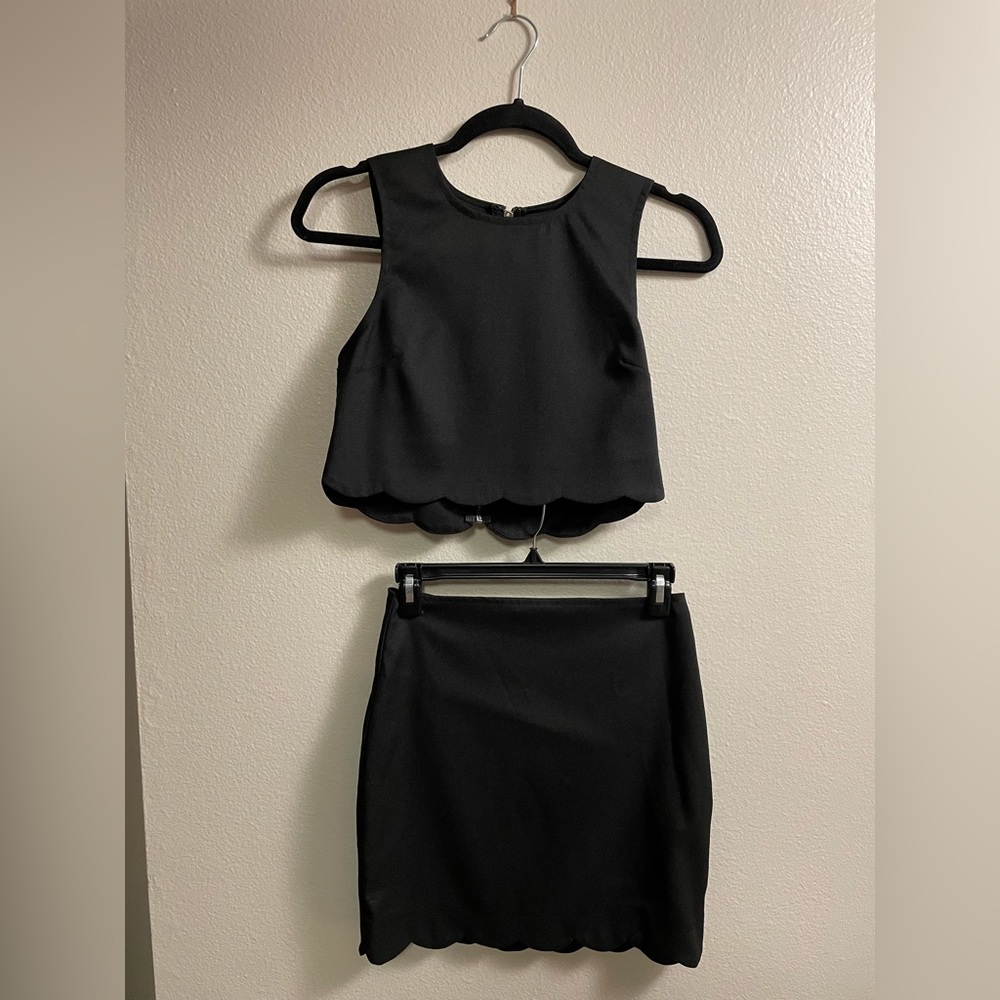Black 2 piece top with skirt. Like new. Great material.